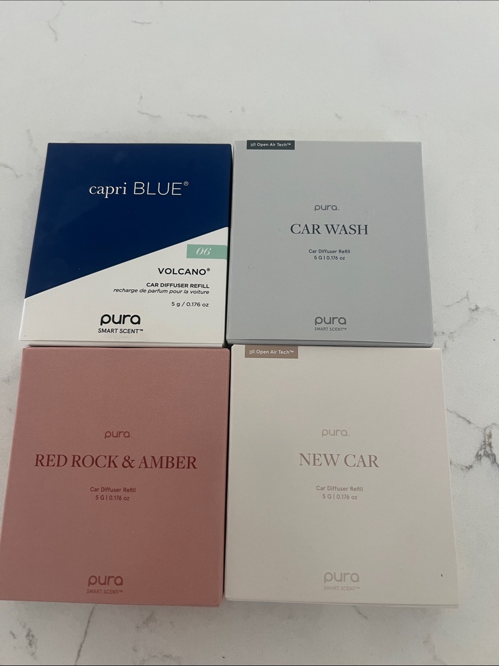Pura car diffuser refill set in blue, gray, pink, cream